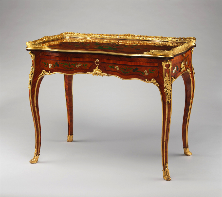 dfdd - Grand Boudoir Across eighteenth- and nineteenth‑century Europe, the simple act of adding a drawer transformed the table from a bare horizontal surface into a discreet container of private life. Writing tables housed correspondence and sealing wax, dressing tables concealed cosmetics and intimate accessories, while slender side and console tables near doors held keys, calling cards, and coins. These modest compartments altered daily routines, reorganised interiors, and encouraged new rituals of order, privacy, and display. From Georgian restrained elegance to the rich veneers of Empire and the curving exuberance of Victorian design, tables with drawers became barometers of taste and social aspiration. Cabinetmakers in London, Paris, Vienna, and beyond worked in mahogany, walnut, oak, and rosewood, refining drawer construction with hand‑cut dovetails, oak or deal linings, and runners worn smooth by centuries of use. Their craftsmanship is still legible in the quiet details: the weight of a solid oak drawer bottom, the faint irregularity of a hand‑filed brass handle, or the subtle ripples of planed timber beneath an old polish. For today’s collector, understanding these nuances is essential. The distinction between a writing table and a side table, between an original dressing table and one later “improved” with extra drawers, rests on reading proportions, construction methods, and wear patterns as closely as any archival document. Equally, restoration—too often heavy‑handed—can blur the very evidence that proves authenticity, from replaced drawer runners to over‑polished tops that erase the soft sheen of age. As demand grows for honest, usable antique furniture, genuine tables with intact drawers, sympathetic repairs, and untouched interiors are increasingly prized, not merely as decorative accents, but as historical witnesses to the evolving choreography of work, leisure, and privacy in the European home.