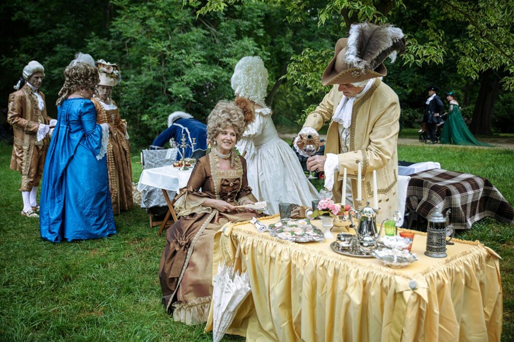 French Aristocracy 1 - Grand Boudoir A charming Rococo-themed tea party with guests in elaborate 18th-century costumes in Leipzig, Germany.