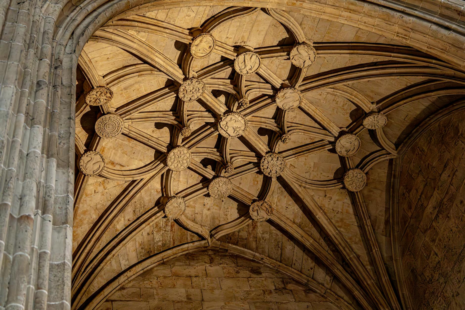 The Hidden Psychology of Gothic Cathedrals 4 - Grand Boudoir Intricate Gothic ceiling with detailed stone carvings in a historic cathedral.