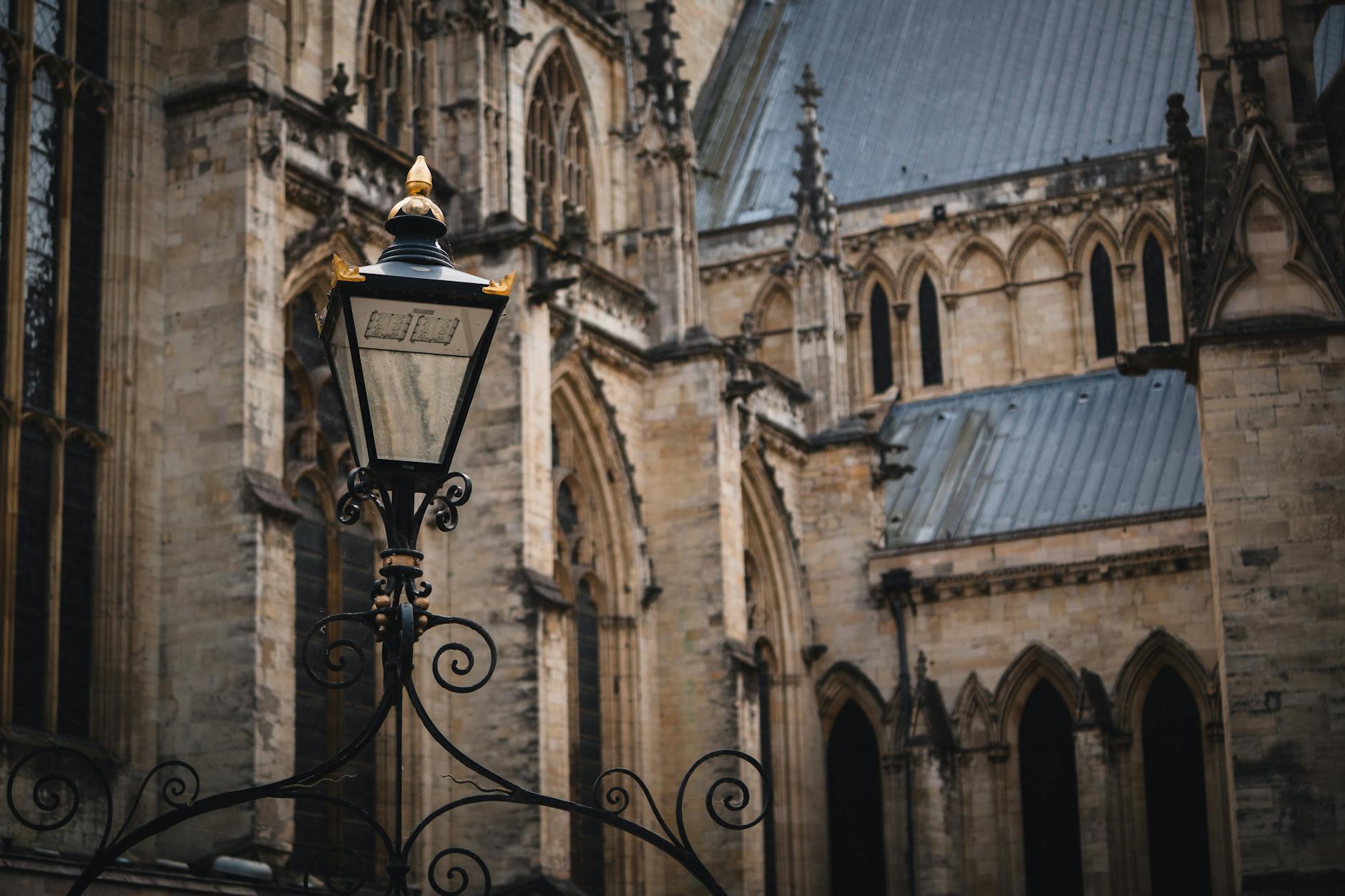 The Hidden Psychology of Gothic Cathedrals 5 - Grand Boudoir A classic street lantern against the backdrop of York Minster's Gothic architecture.