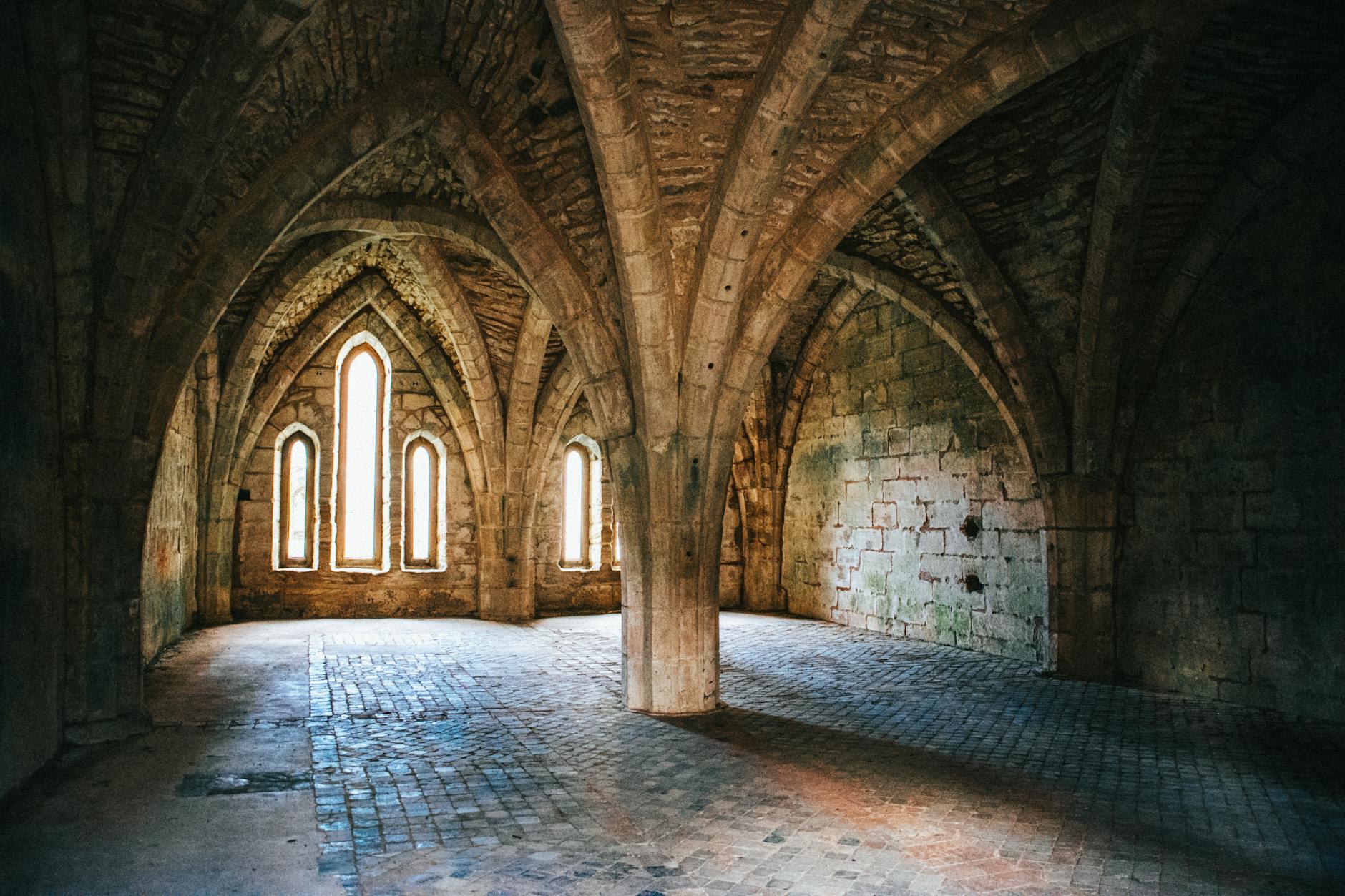 Within Stone and Shadow The Enduring Spell of Castle Interiors 2 - Grand Boudoir Explore the mysterious and majestic interior of an abandoned Gothic abbey, featuring stunning arches and ancient masonry.
