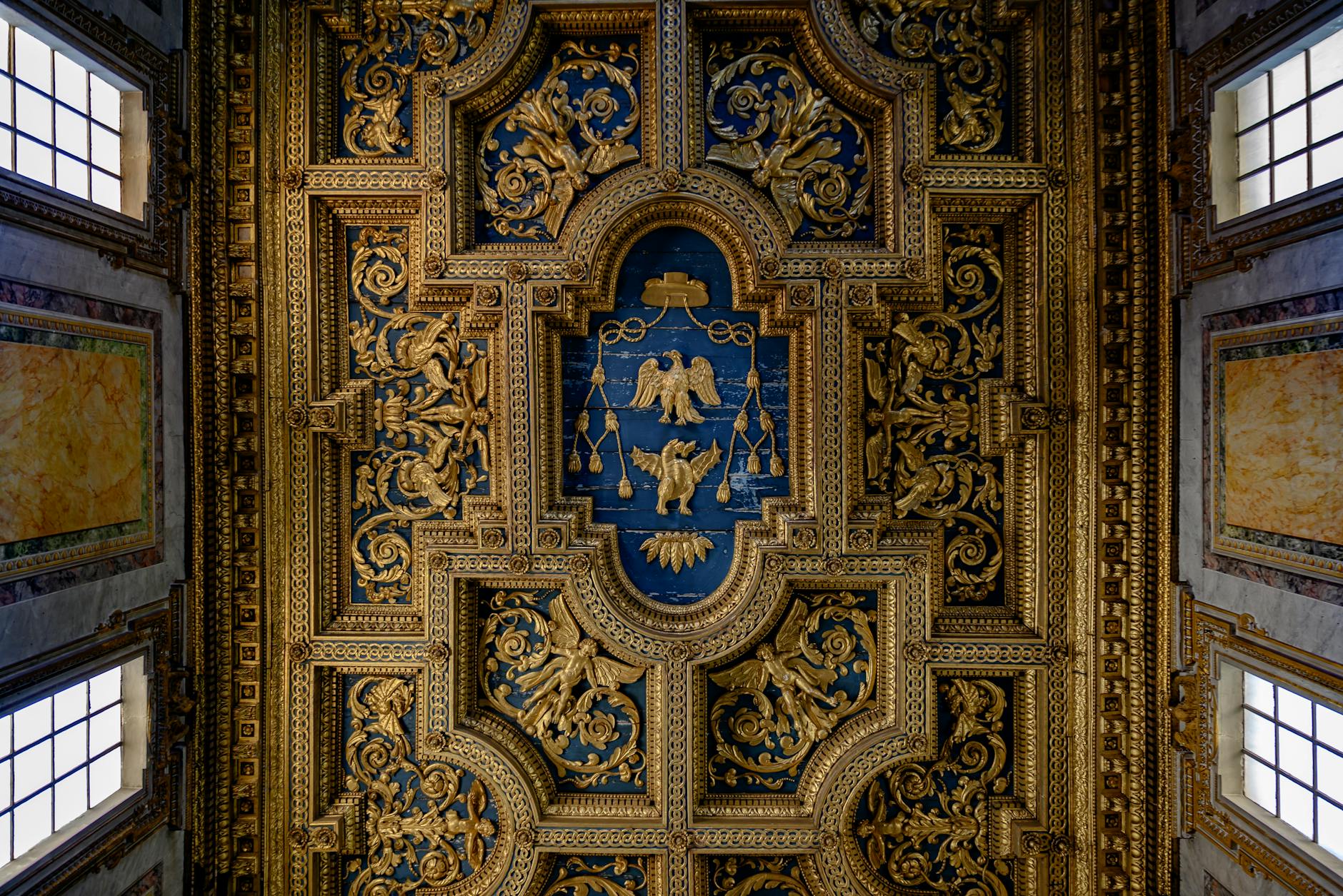 pexels photo 37503501 - Grand Boudoir Intricate gold and blue ceiling design in a historic Roman building, showcasing classical artistry and architecture.