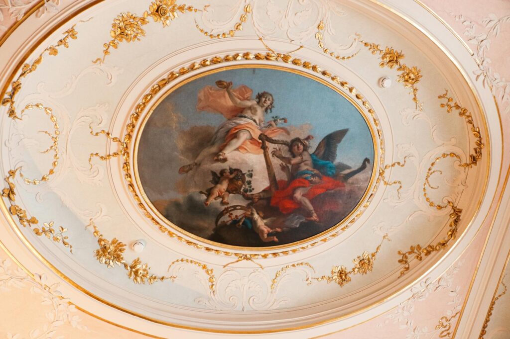 rococo room 4 - Grand Boudoir Elegant ceiling featuring intricate floral motifs and a classic painted fresco.