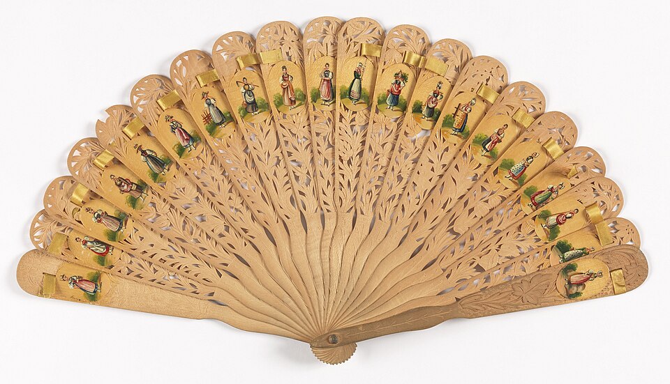 Brise Fan Austria 1873 CH 18208689 - Grand Boudoir Delicate carvings, secret messages, and vanished elegance—discover how antique hand fans reveal the hidden stories of centuries past.