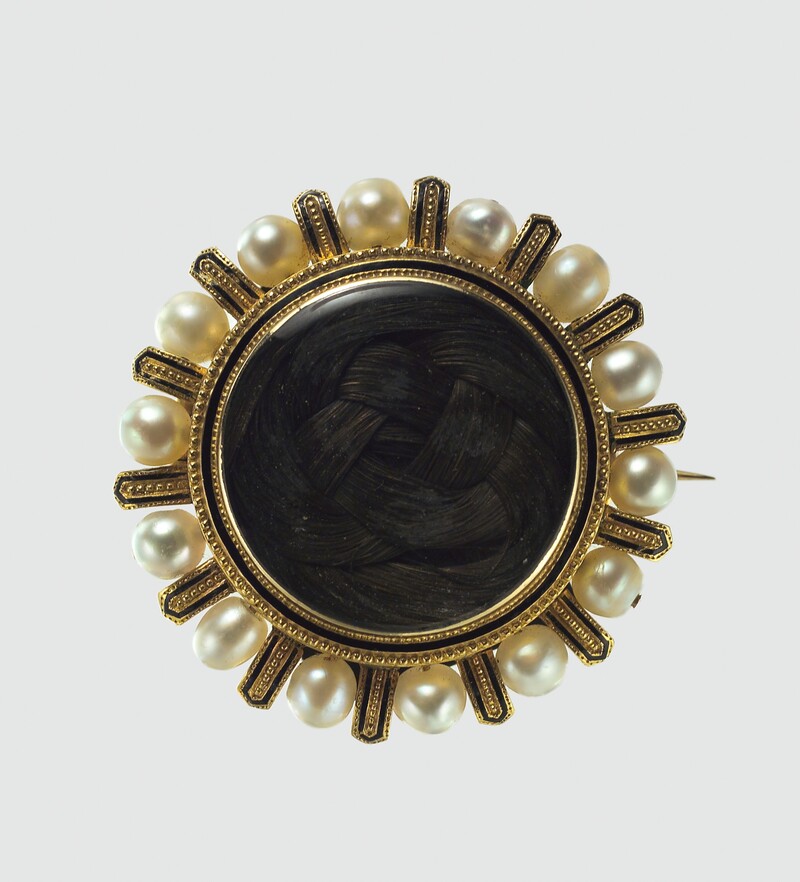 DP1103711 - Grand Boudoir Discover the secrets behind Victorian mourning brooches—tiny relics of grief, love, and hidden messages worn close to the heart.