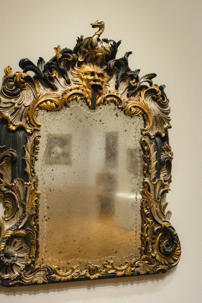 A mirror is hanging on a wall