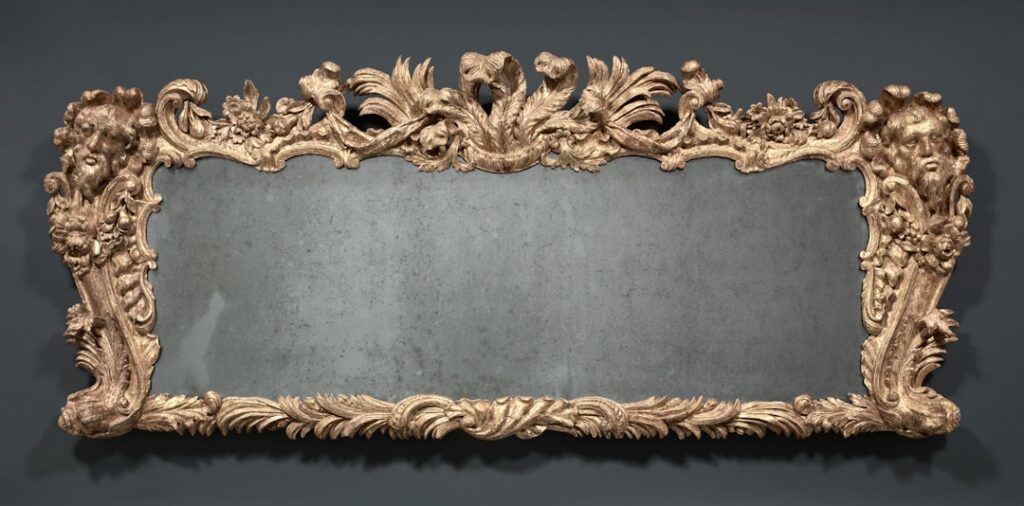 Ornate gilded mirror with carved floral details