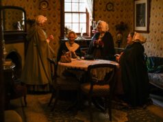 Victorian Upholstery Fabric: History, Craft, and Lasting Appeal Victorian women in a cozy parlor engaged in conversation, dressed in period attire.