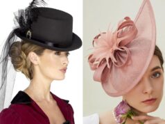 Victorian Hats: Strange Fashion Secrets Historians Rarely Reveal Woman in ornate dress with ruffled shawl stands by window.