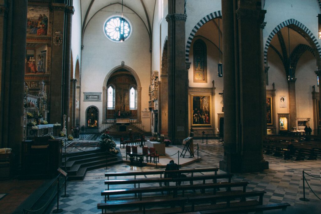 View of a historic cathedral in Florence, showcasing gothic arches and religious art.